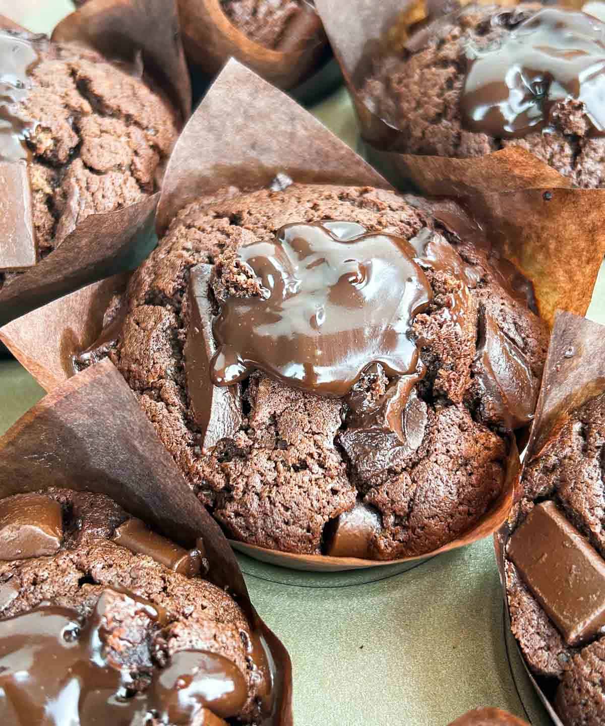 a zoom-out shot of the final product of the chocolate muffin with chocolate ganache filling.