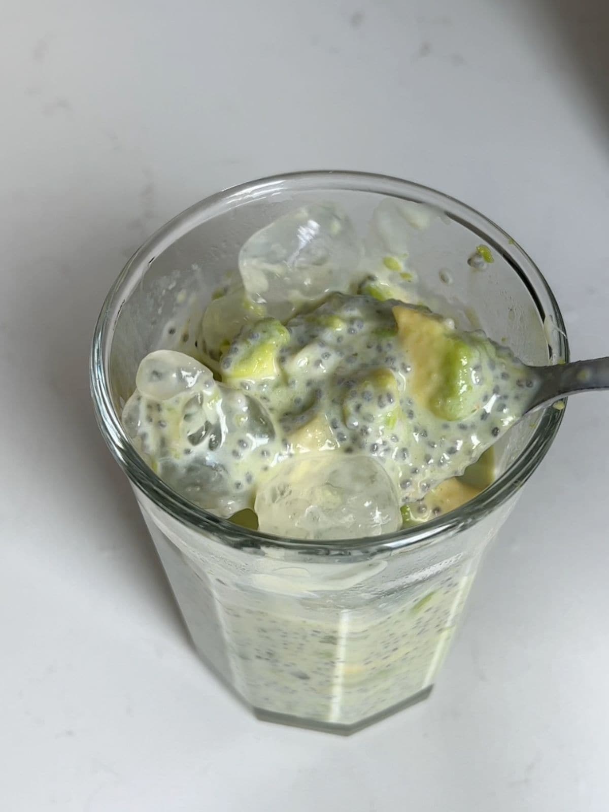 Stirring together all of the ingredients for avocado chia pudding.