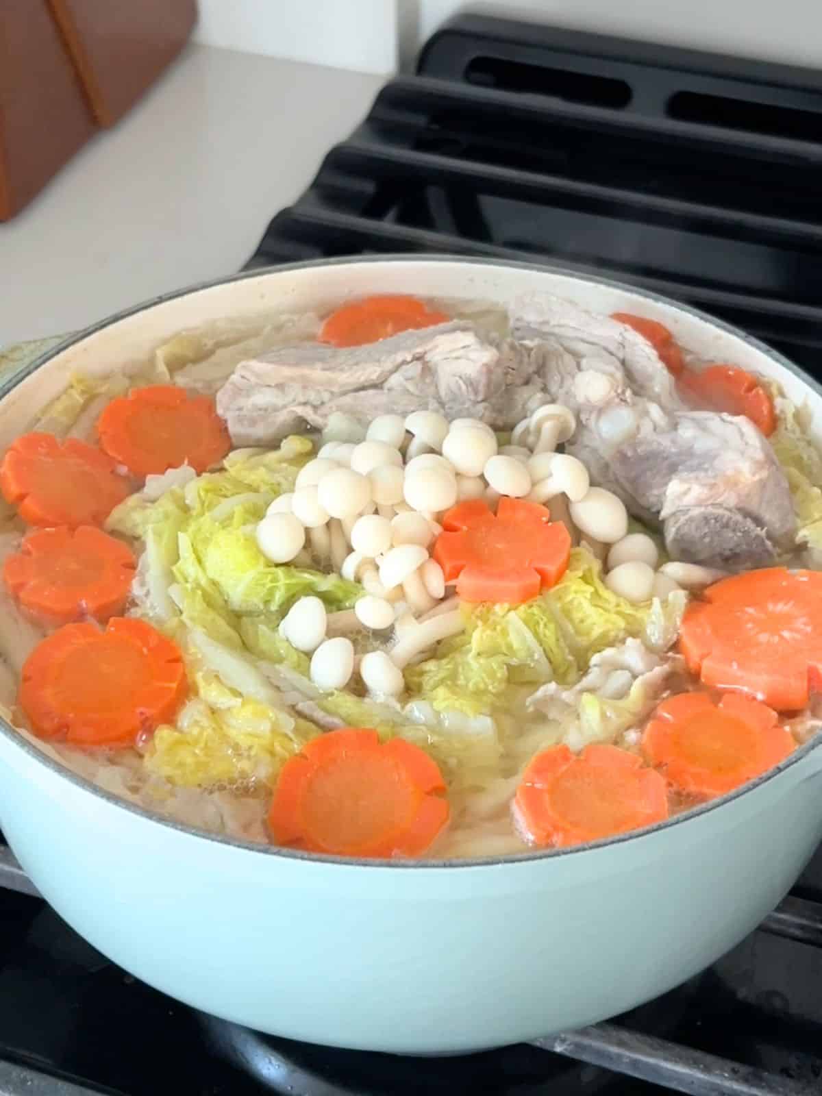 Finished Vietnamese mille feuille nabe in a Dutch oven on the stove.