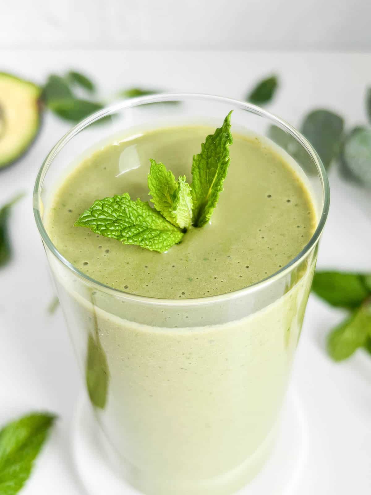 45 degree angled overhead view of the smoothie with a mint garnish in the middle.